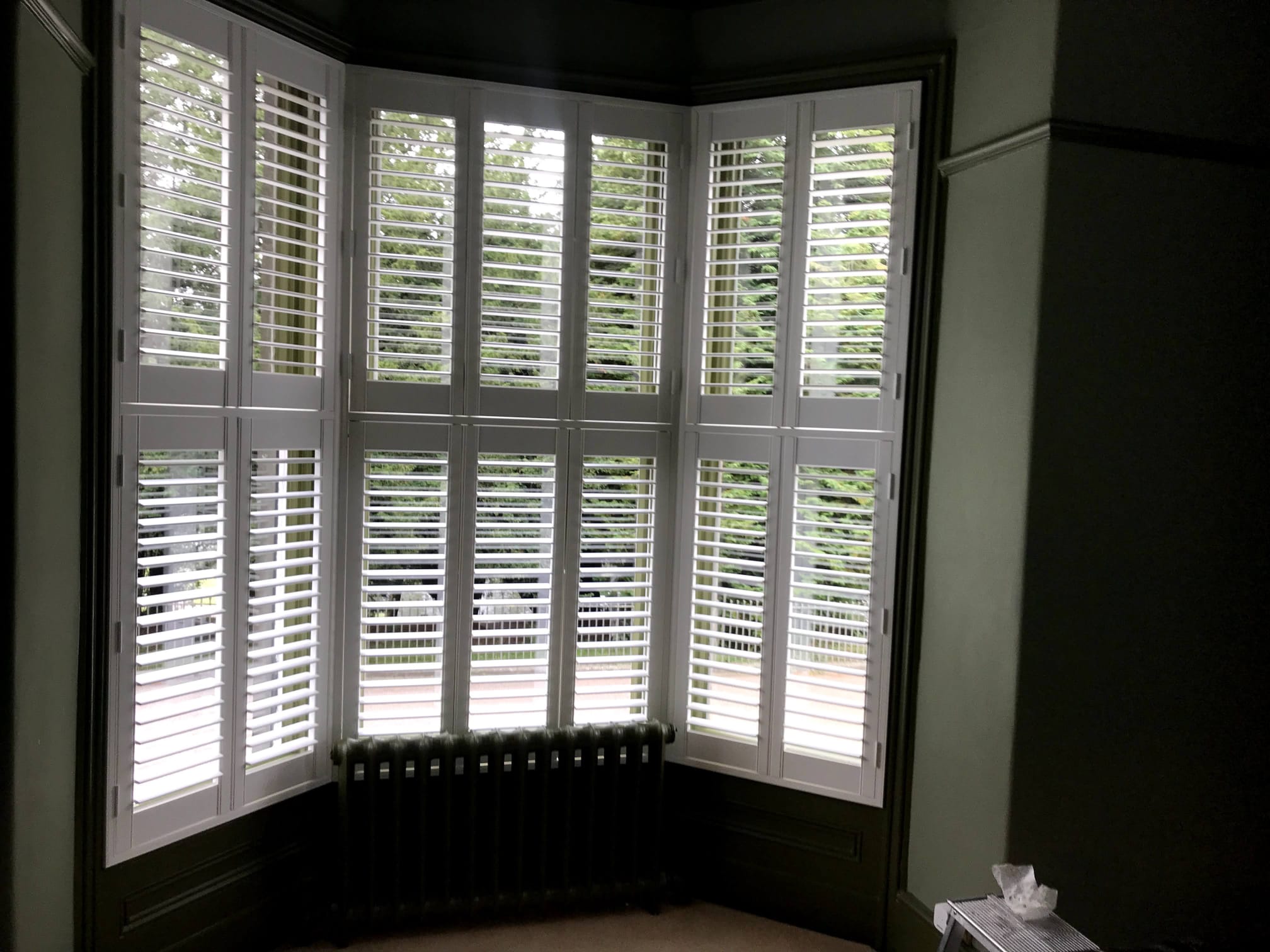 Tier on tier shutters above radiator